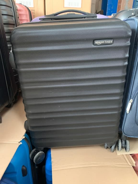 Amazon Basics Hartschalen-Koffer Trolley schwarz 4-Rad mit Querrippen (Reisekoffer)